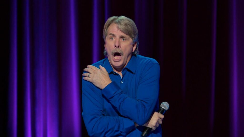 Jeff Foxworthy opens his mouth while performing on stage