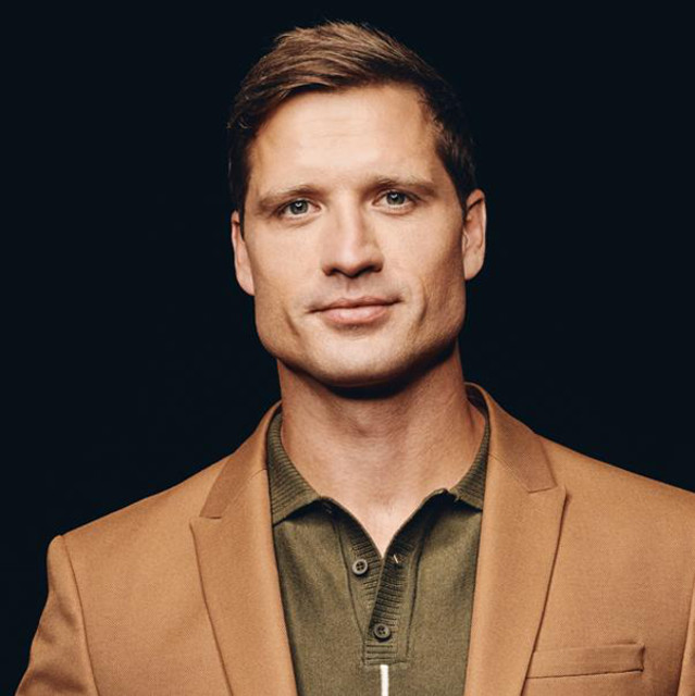 Walker Hayes wearing a brown suit