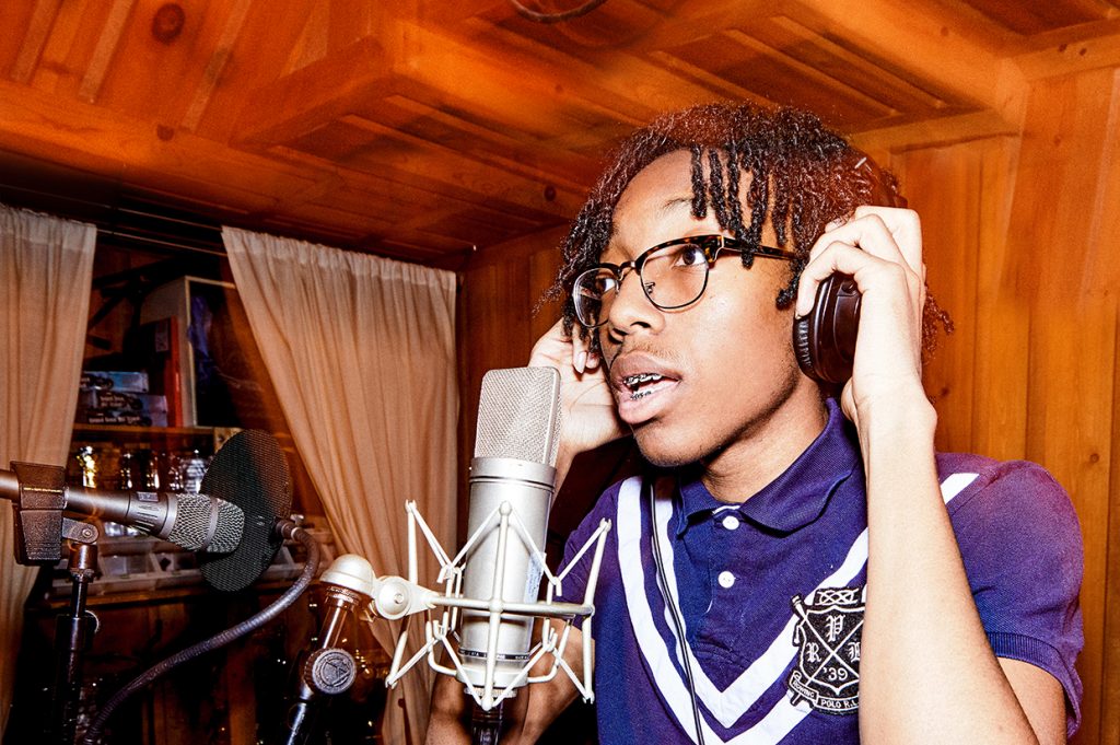 Lil Tecca in a studio recording a music