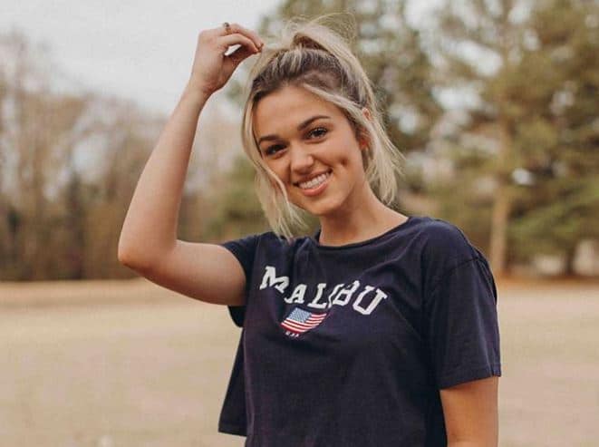 Sadie Robertson touching her hair 