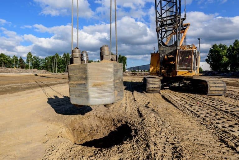 tractor working on site in constructing dynamic compaction