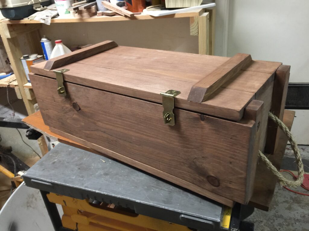 a wooden ammo box kept on top of a table