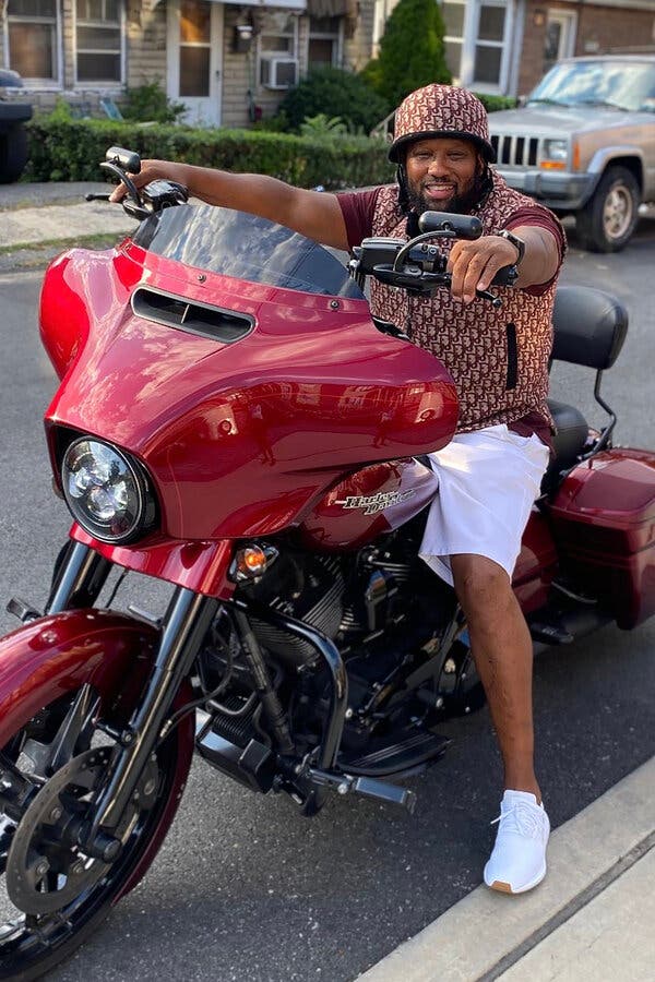 Alpo Martinez sitting on a red bike