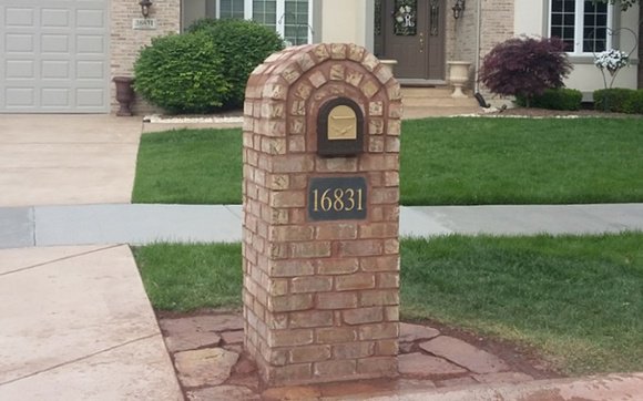 a cement constructed mailbox shield