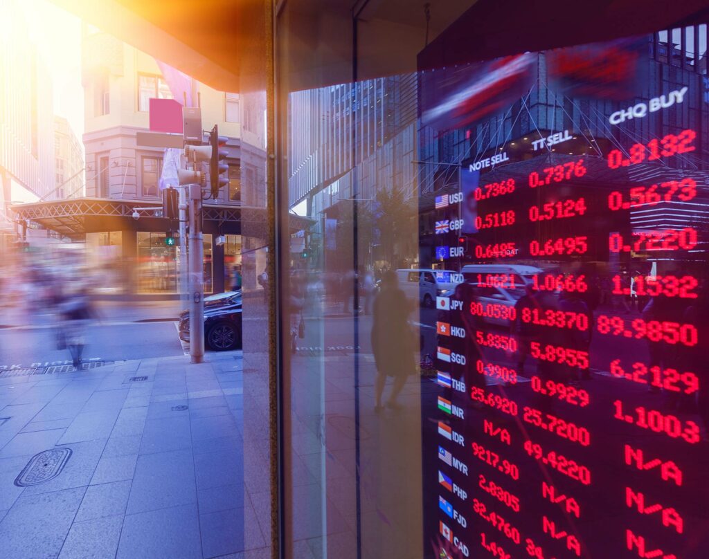 a glass showing the exchange rate for different countries 