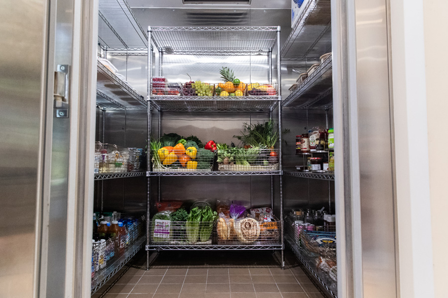 This is a walk in cooler with shelves.